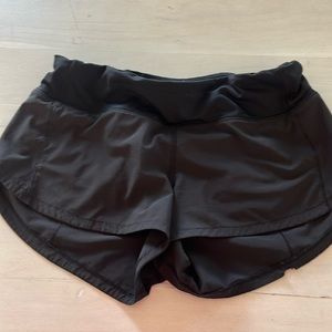 Lululemon, black size 4 speed-ups. Low rise, 2.5”